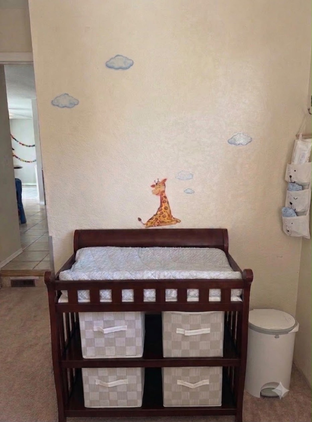Clean diaper changing and care station with organized baskets